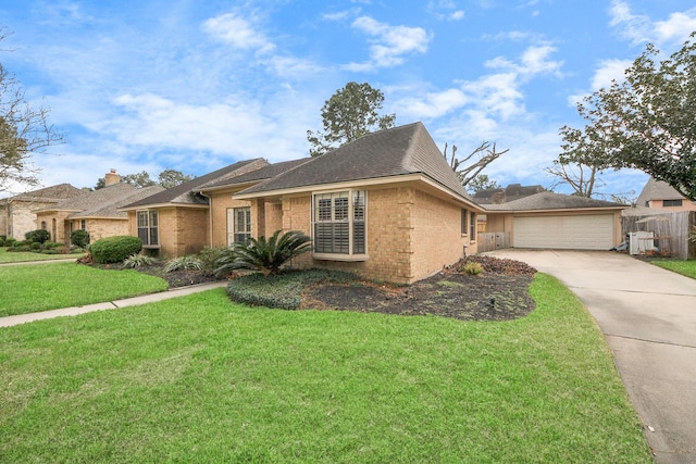 view of front of property with a garage and a front lawn