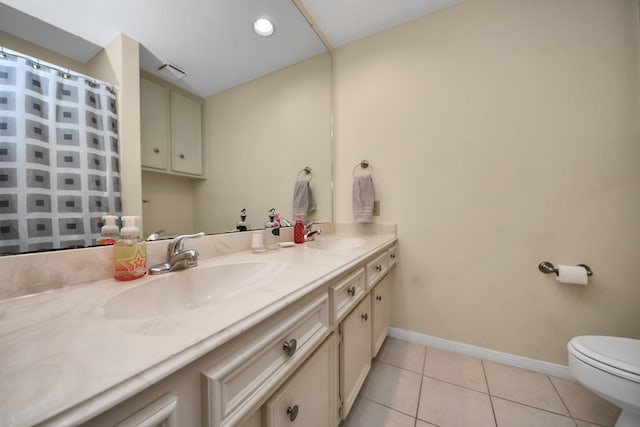 bathroom with vanity, tile patterned floors, toilet, and a shower with shower curtain