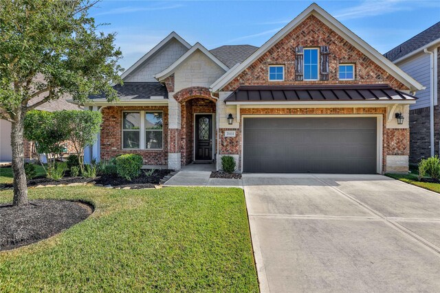 view of front of house featuring a garage and a front yard