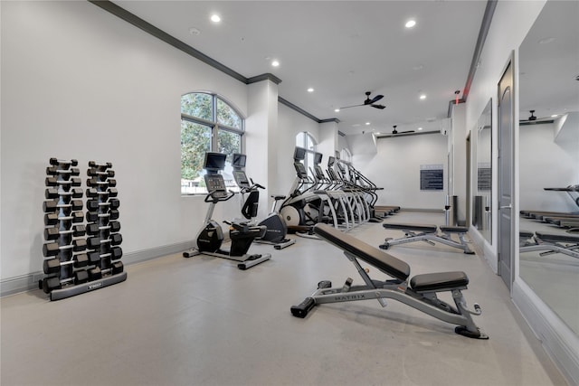 exercise room with baseboards, ornamental molding, and recessed lighting