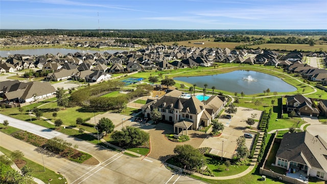 aerial view featuring a water view and a residential view