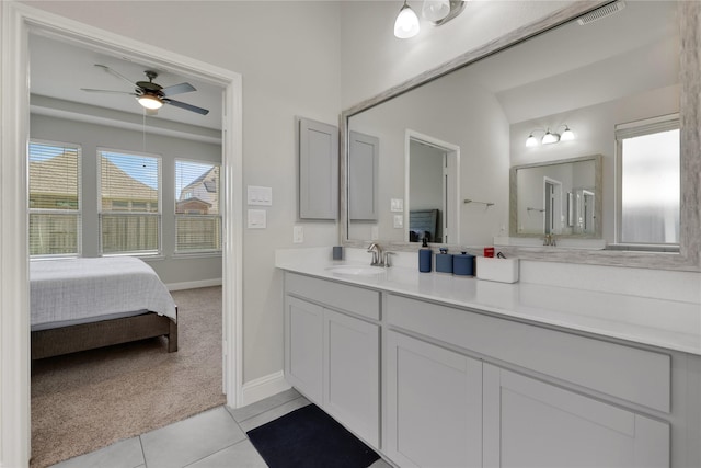 full bathroom featuring ensuite bathroom, ceiling fan, vanity, visible vents, and tile patterned floors