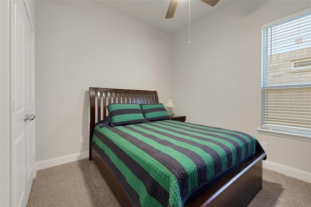 bedroom featuring carpet, baseboards, and a ceiling fan