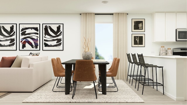 dining space featuring light hardwood / wood-style floors