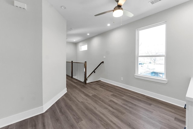 spare room featuring hardwood / wood-style flooring and ceiling fan