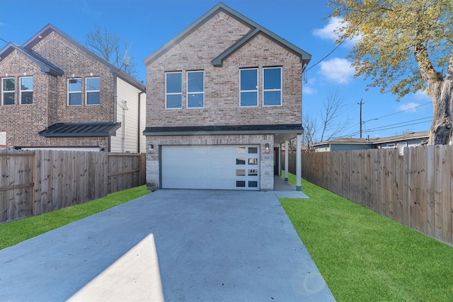 view of property with a garage and a front lawn