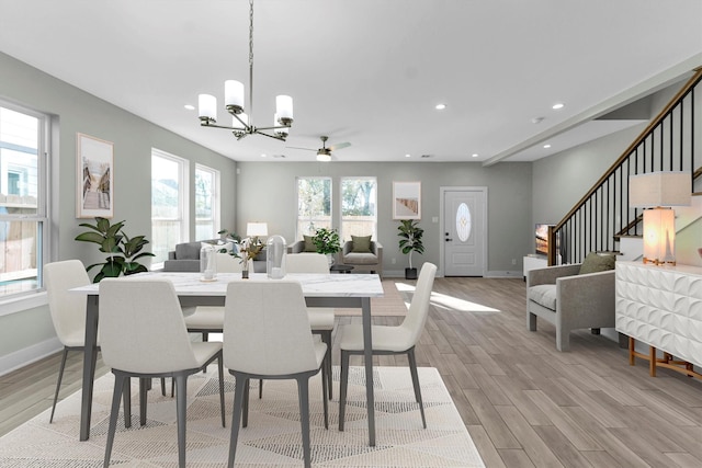 dining room featuring an inviting chandelier and light hardwood / wood-style flooring