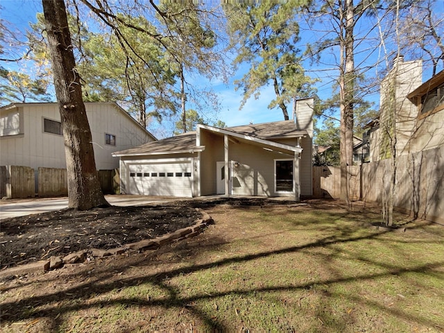 view of side of home with a garage and a yard