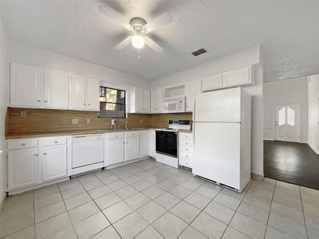 kitchen featuring white cabinetry, white appliances, tasteful backsplash, and ceiling fan