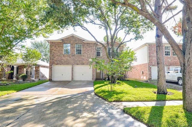 view of front property featuring a garage and a front yard