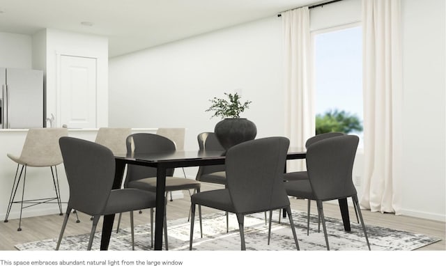 dining room with light wood-type flooring