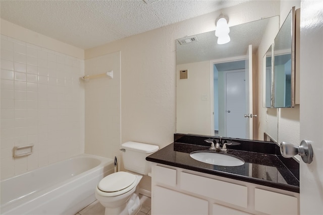 full bathroom with washtub / shower combination, tile patterned flooring, vanity, a textured ceiling, and toilet