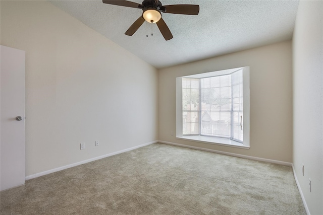 unfurnished room with light carpet, ceiling fan, and a textured ceiling