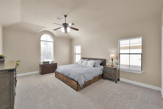 carpeted bedroom featuring vaulted ceiling and ceiling fan