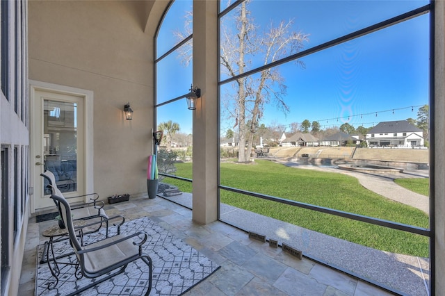 unfurnished sunroom featuring a healthy amount of sunlight