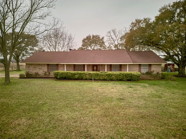 ranch-style home with a front yard