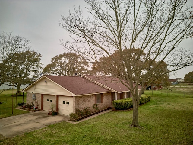 view of front of home with a garage and a front yard