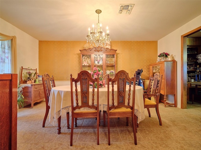 dining room featuring a chandelier