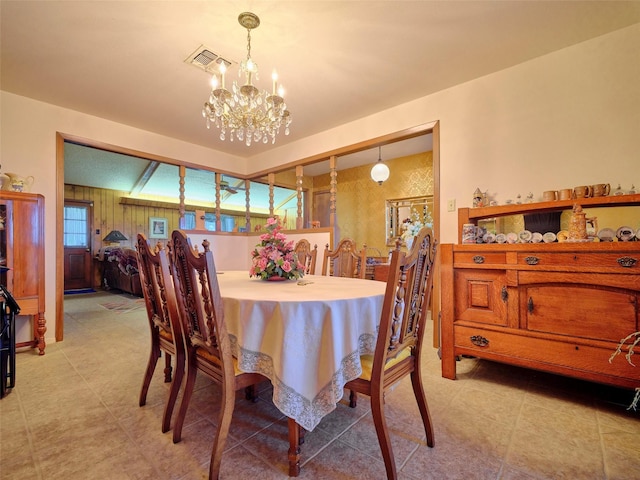 dining space with a chandelier