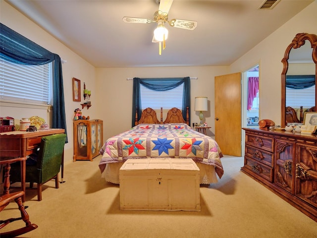 carpeted bedroom featuring ceiling fan