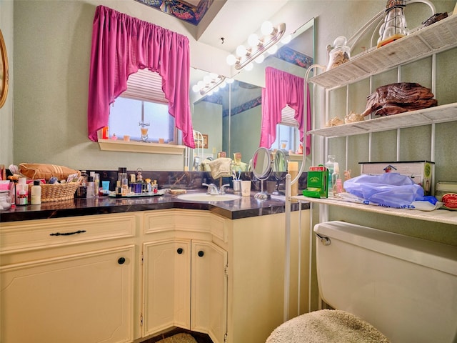 bathroom with vanity and toilet