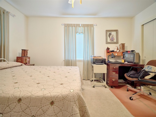 carpeted bedroom with a closet