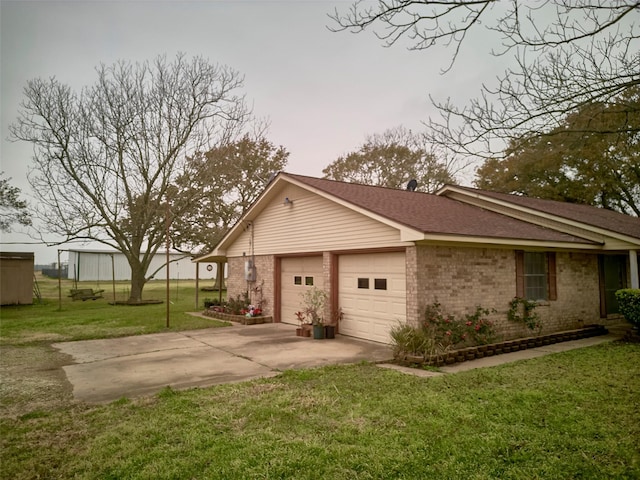 view of property exterior with a garage and a lawn