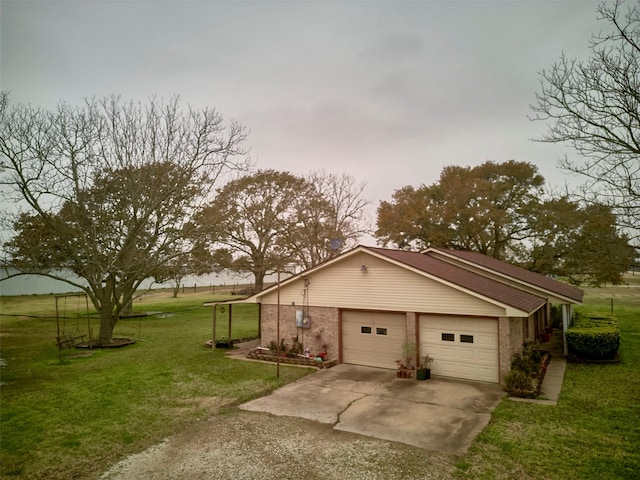 view of front of property with a garage and a front lawn