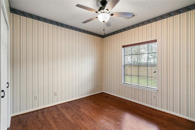 spare room featuring hardwood / wood-style flooring and ceiling fan