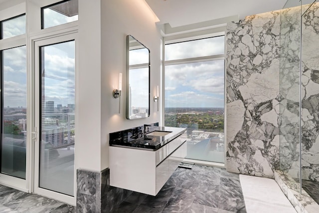 bathroom with vanity and a wealth of natural light