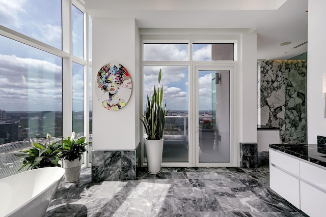 interior space featuring vanity and a bathtub