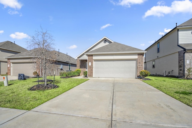 view of front of home with a garage and a front lawn