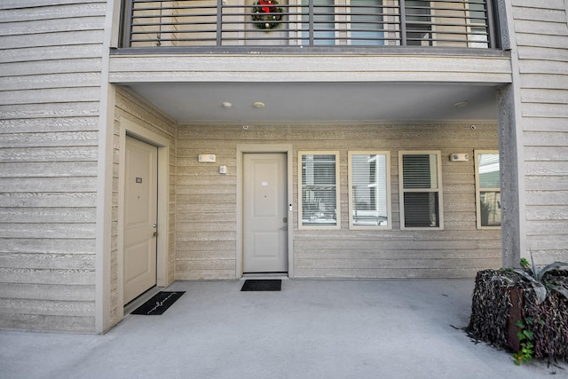 property entrance with a balcony