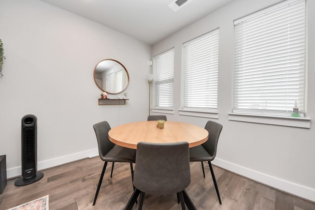 dining area featuring hardwood / wood-style floors