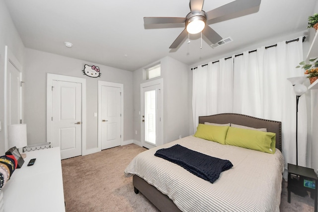 carpeted bedroom with ceiling fan