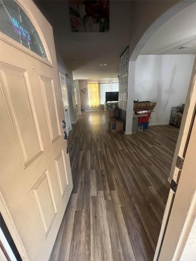 corridor featuring dark hardwood / wood-style flooring