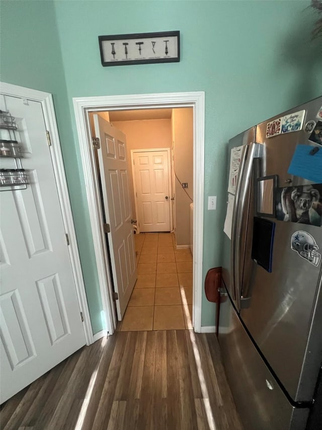 corridor with hardwood / wood-style floors