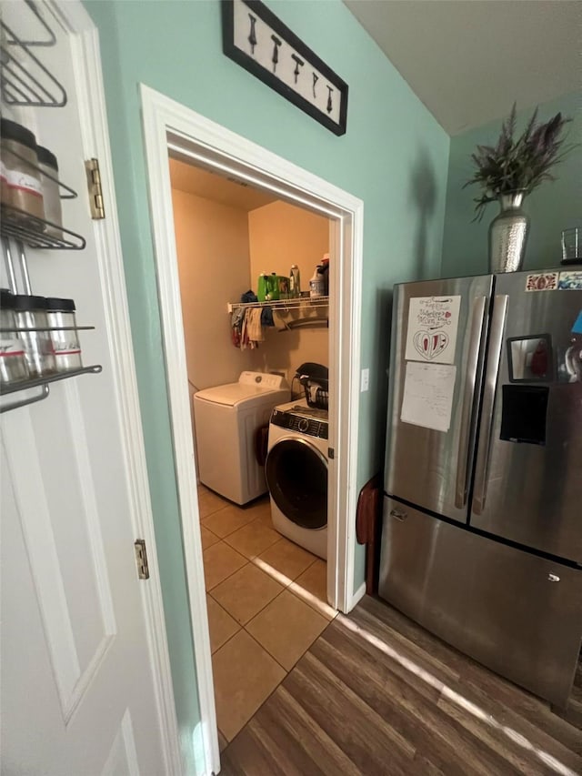 laundry room with tile patterned floors and washer and dryer