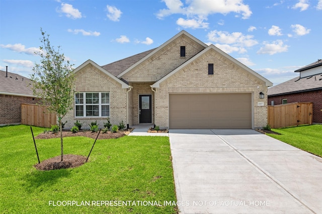 view of front of property featuring an attached garage, fence, concrete driveway, and a front yard