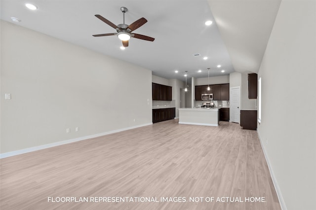 unfurnished living room with light wood-type flooring, ceiling fan, baseboards, and recessed lighting