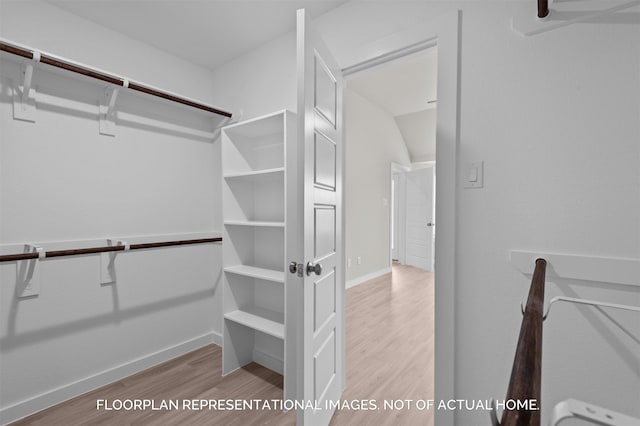 spacious closet with wood finished floors