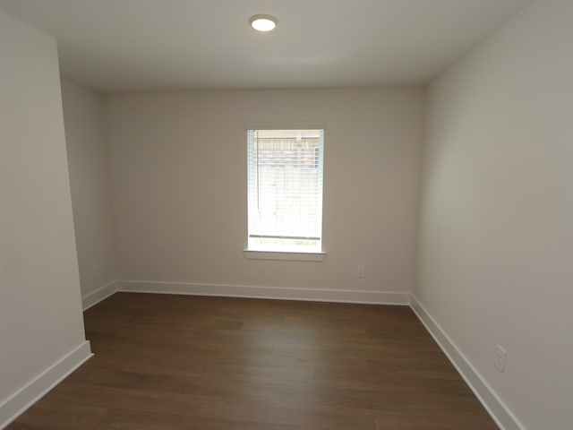 22478 Birchfield Grove Ln, New Caney, TX 77357 - spare room with dark wood-type flooring and baseboards