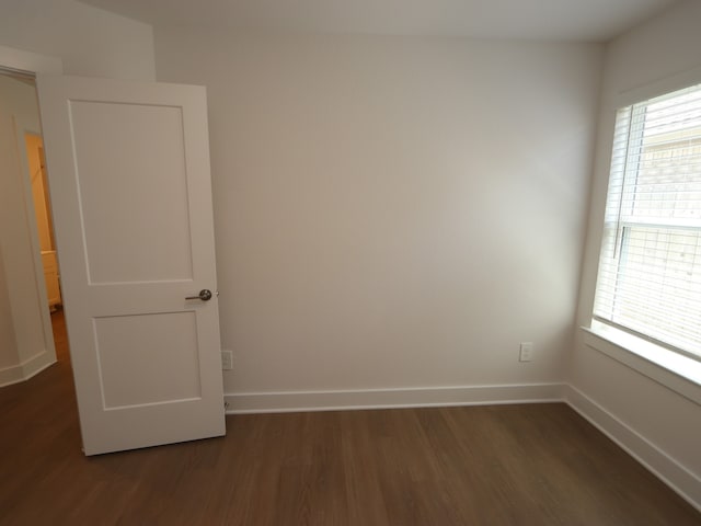 22478 Birchfield Grove Ln, New Caney, TX 77357 - empty room featuring dark wood finished floors, plenty of natural light, and baseboards