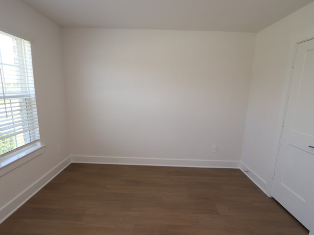 22478 Birchfield Grove Ln, New Caney, TX 77357 - spare room featuring healthy amount of natural light, dark wood-type flooring, and baseboards