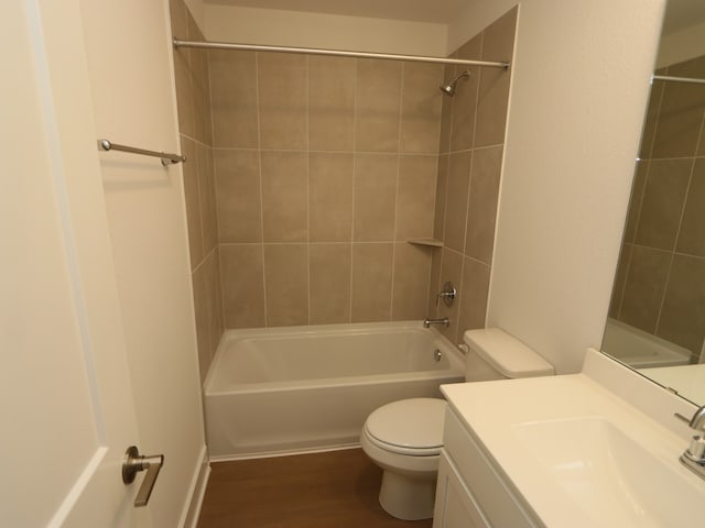 22478 Birchfield Grove Ln, New Caney, TX 77357 - bathroom featuring toilet, vanity, shower / bathtub combination, and wood finished floors