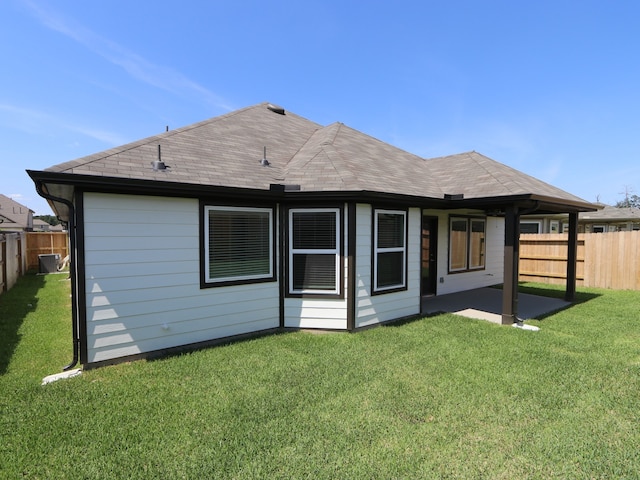 22478 Birchfield Grove Ln, New Caney, TX 77357 - back of house featuring a patio area and a shingled roof