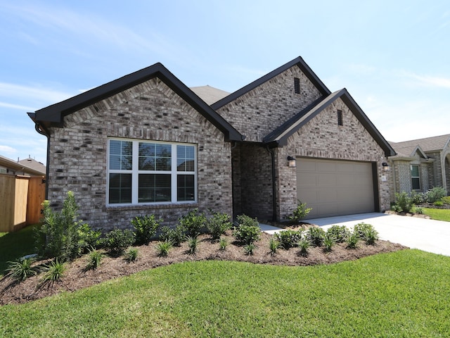 22478 Birchfield Grove Ln, New Caney, TX 77357 - view of front facade with driveway, an attached garage, and brick siding