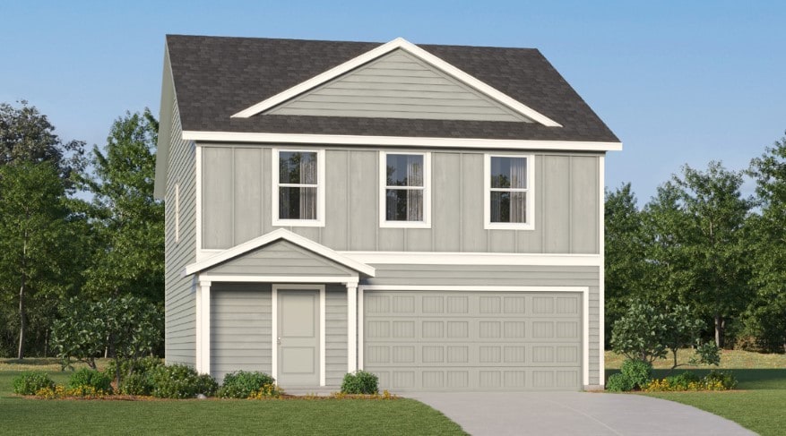 view of front facade with a garage and a front lawn