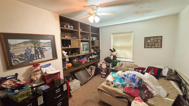 interior space featuring ceiling fan and a textured ceiling