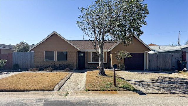 single story home with a garage